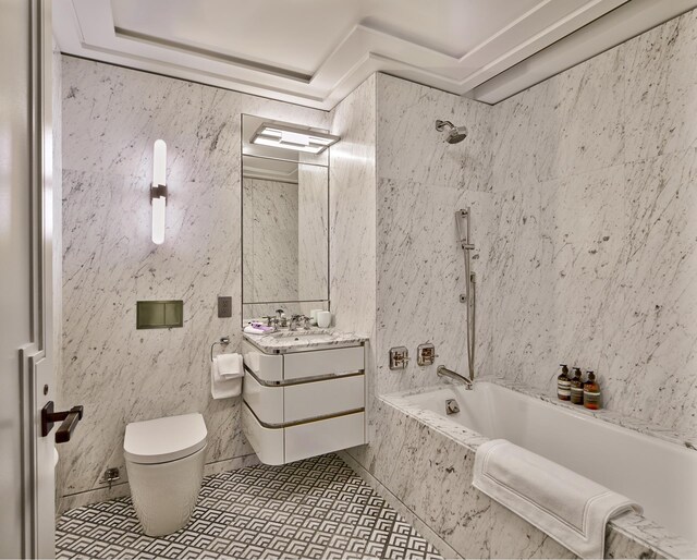 full bathroom with tiled shower / bath combo, vanity, tile patterned flooring, and toilet