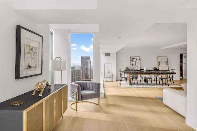 sitting room with light hardwood / wood-style floors