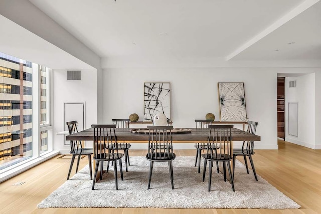 dining space with light wood-type flooring