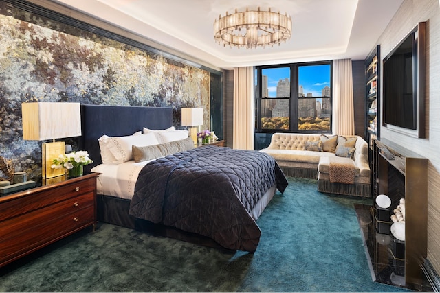 bedroom with carpet and a raised ceiling