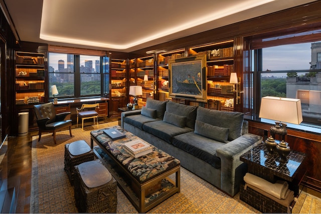 825 5th Ave Unit 15Flr, New York City, NY 10065 - living area featuring a raised ceiling, wood finished floors, and built in shelves