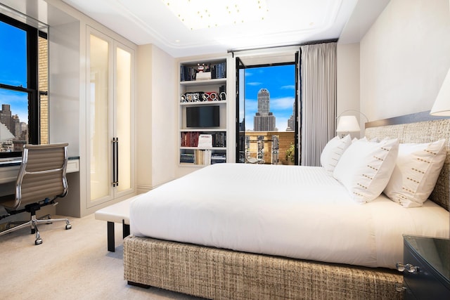 carpeted bedroom featuring a view of city