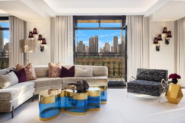 living room with a view of city and carpet flooring