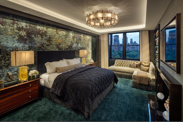 825 5th Ave Unit 15Flr, New York City, NY 10065 - bedroom with dark colored carpet, a chandelier, a raised ceiling, and a view of city