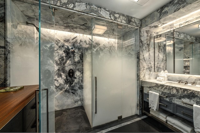 825 5th Ave Unit 15Flr, New York City, NY 10065 - bathroom featuring marble tiled floors, a marble finish shower, and vanity