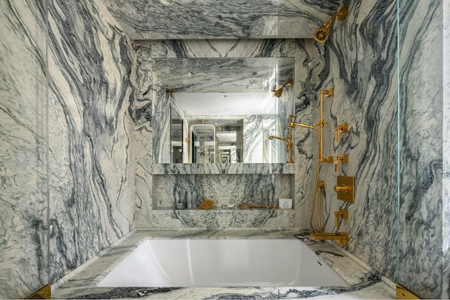 825 5th Ave Unit 15Flr, New York City, NY 10065 - bathroom with a tub with marble appearance