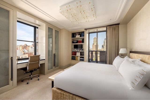 825 5th Ave Unit 15Flr, New York City, NY 10065 - carpeted bedroom featuring a city view and a desk