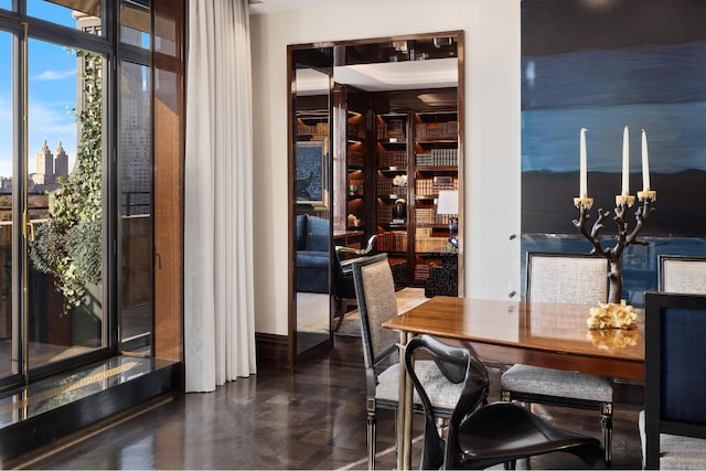 dining room with dark parquet flooring