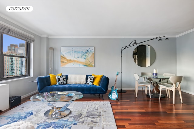 living room with visible vents, crown molding, baseboards, and wood finished floors