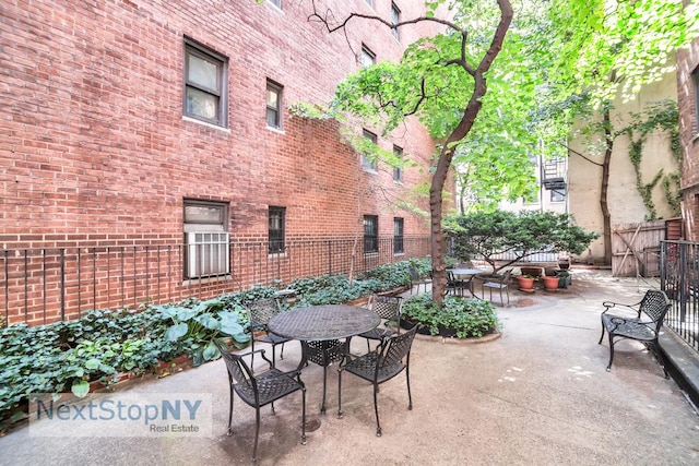 view of patio / terrace featuring outdoor dining area and fence