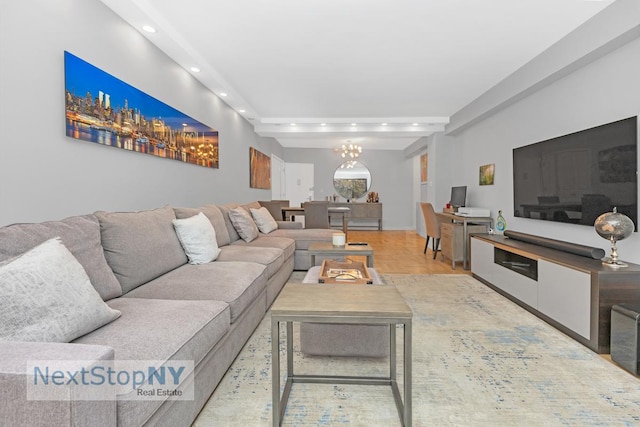 living room with a notable chandelier and recessed lighting