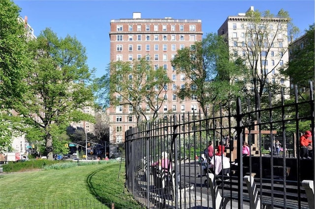 view of gate with a yard