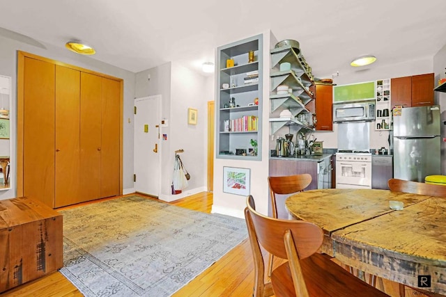 dining room with light wood-type flooring