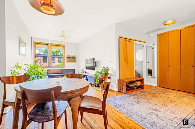 dining area featuring ceiling fan and light hardwood / wood-style floors