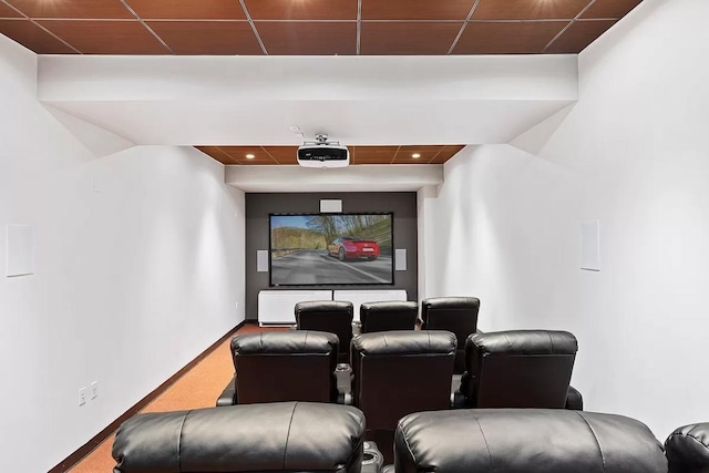 cinema featuring carpet floors and a drop ceiling