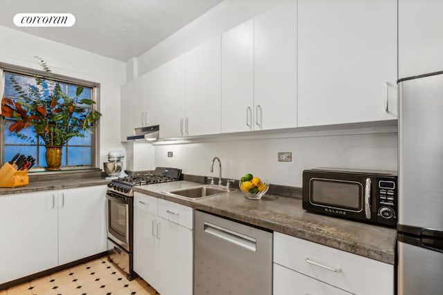 kitchen featuring sink, white cabinets, and stainless steel appliances