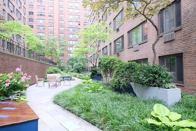 view of property's community with a patio