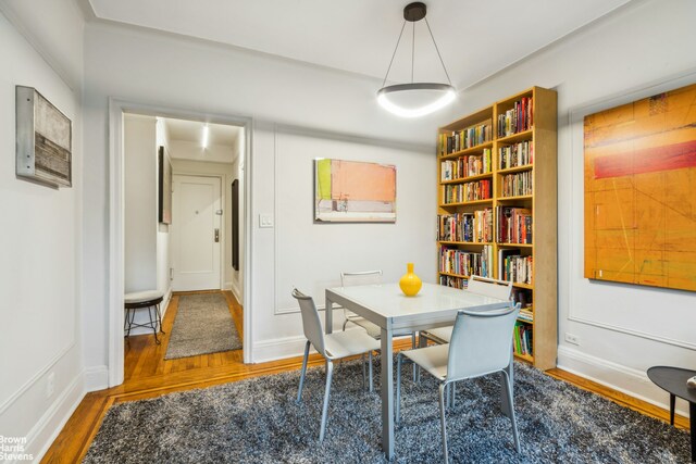 dining room with hardwood / wood-style flooring