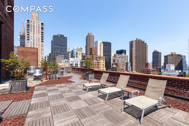 view of patio / terrace featuring a city view