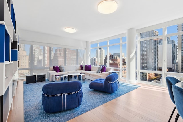 living room with a city view and wood finished floors