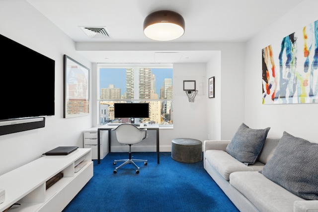 office area featuring visible vents, carpet flooring, and baseboards