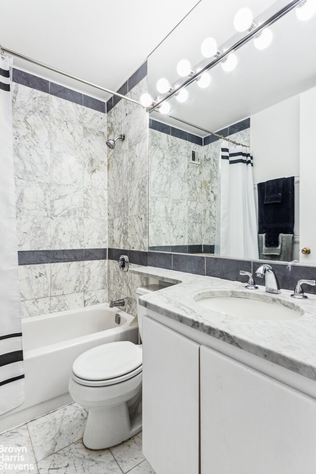 bathroom with toilet, shower / bathtub combination with curtain, marble finish floor, and vanity