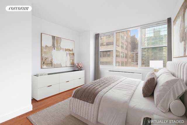 bedroom with light hardwood / wood-style flooring