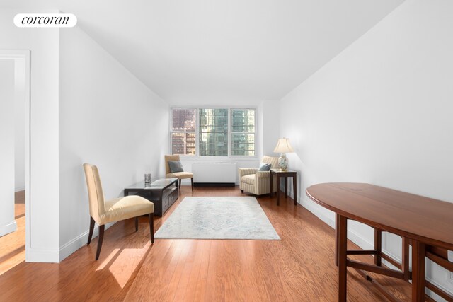 living area with hardwood / wood-style flooring