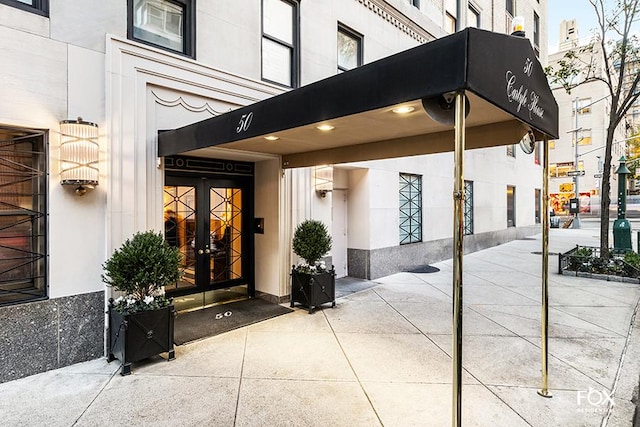 50 E 77th St Unit 11B, New York City, NY 10075 - entrance to property featuring french doors and stucco siding