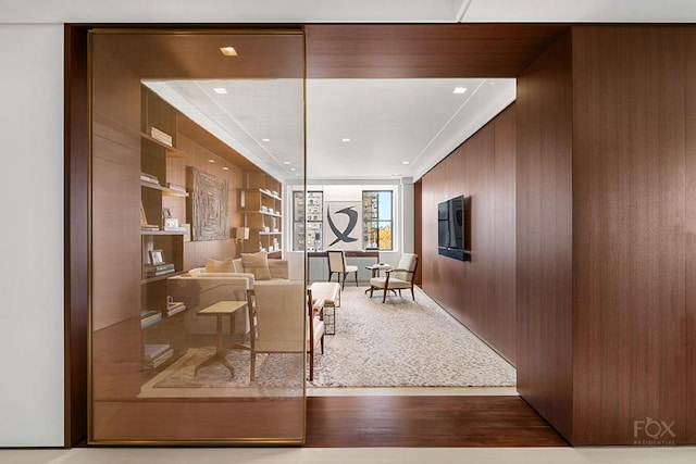 living area with wood walls