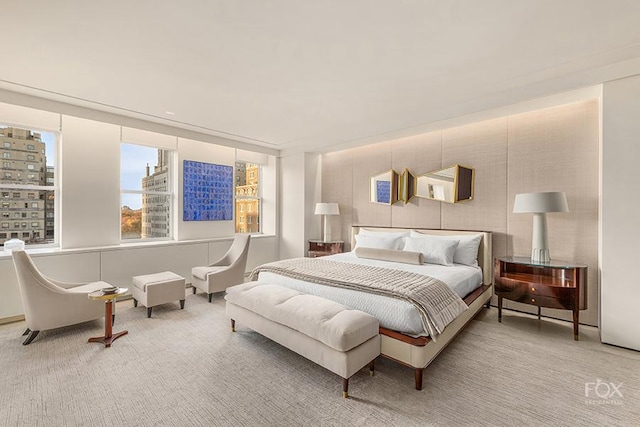 carpeted bedroom featuring a view of city