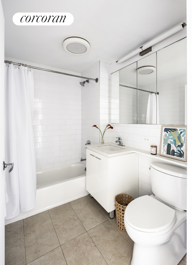 bathroom with tile patterned floors, shower / bath combo, vanity, and toilet