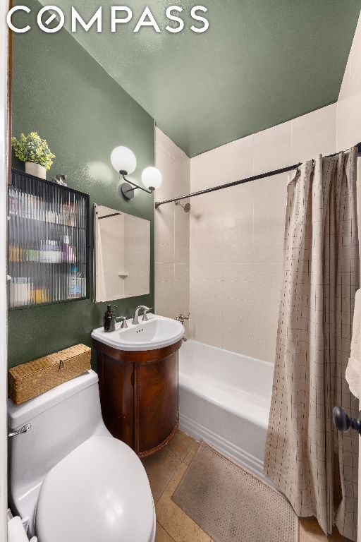 full bathroom with toilet, tile patterned flooring, shower / tub combo, and vanity