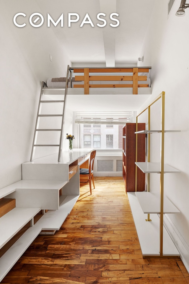 126 W 22nd St Unit 5N, New York City, NY 10011 - stairway with hardwood / wood-style floors