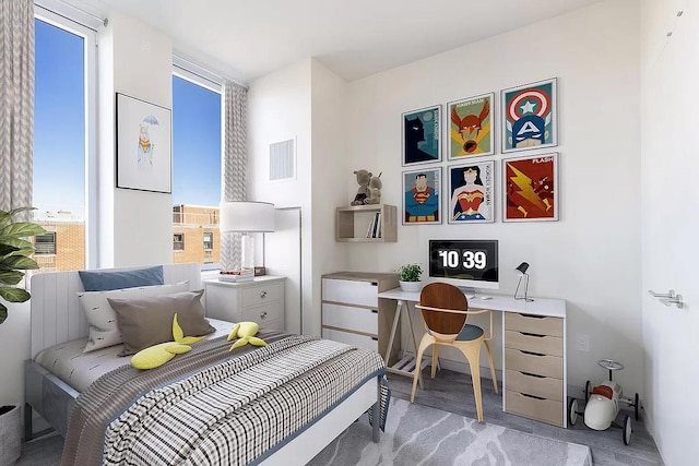 285 W 110th St Unit 7-D, New York City, NY 10026 - bedroom with an office area and light carpet