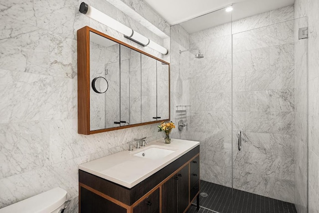 bathroom with vanity, tile walls, an enclosed shower, and toilet