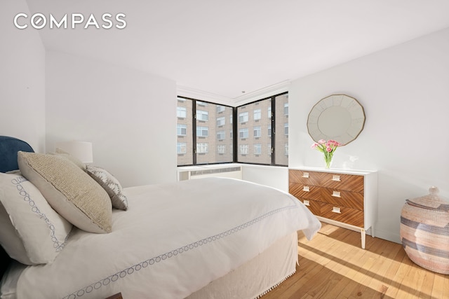 30 W 61st St Unit 9C, New York City, NY 10023 - bedroom with wood finished floors and baseboards