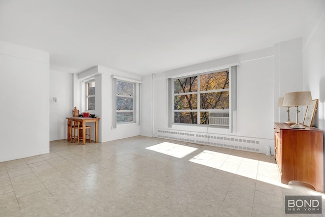 unfurnished living room with a baseboard radiator