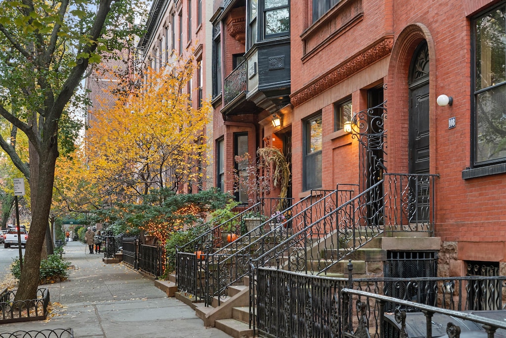 exterior space featuring brick siding