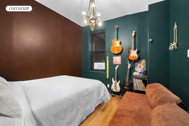 bedroom with an inviting chandelier and wood-type flooring