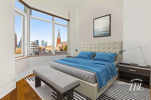 bedroom with hardwood / wood-style flooring