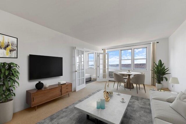 carpeted living room with french doors