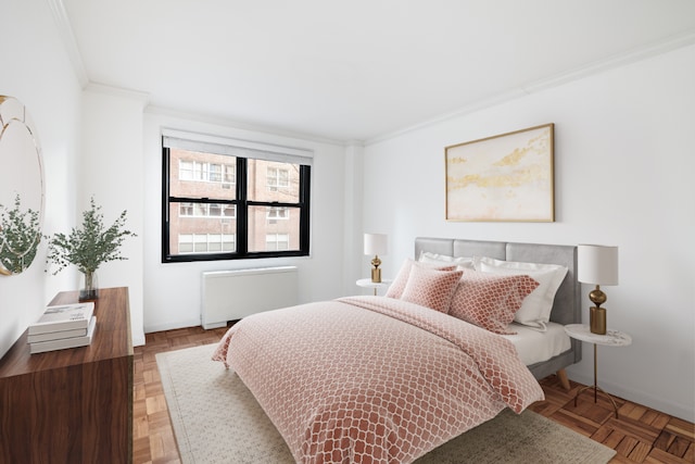 bedroom with crown molding, parquet flooring, and radiator