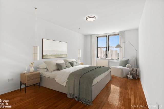 bedroom featuring hardwood / wood-style floors