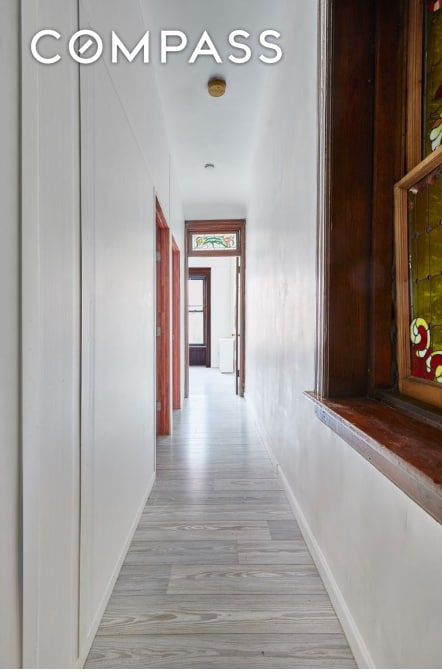 corridor featuring light hardwood / wood-style flooring