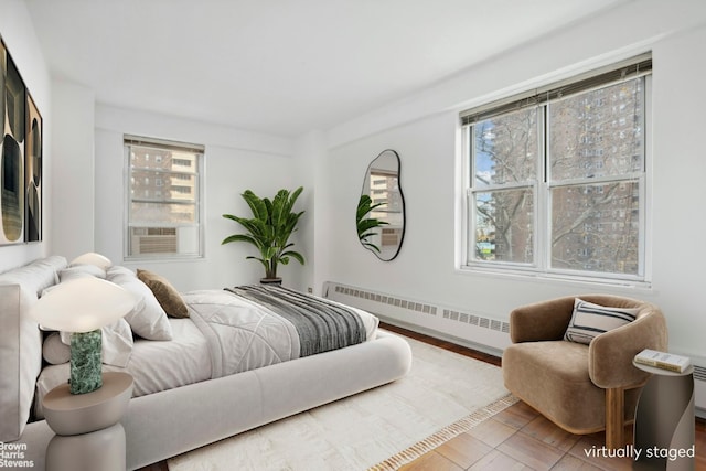 bedroom with radiator and cooling unit