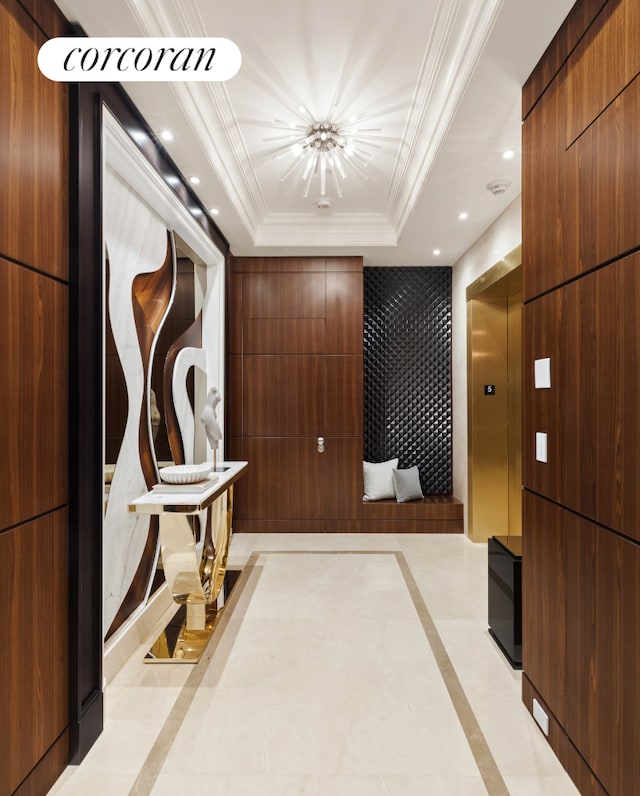 corridor featuring recessed lighting, a tray ceiling, and ornamental molding