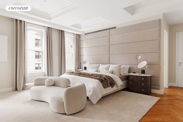 bedroom with coffered ceiling, visible vents, crown molding, and baseboards