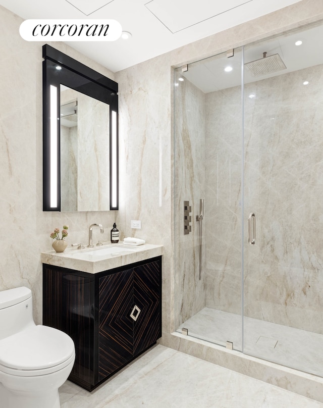 full bathroom with toilet, a marble finish shower, tile walls, and vanity