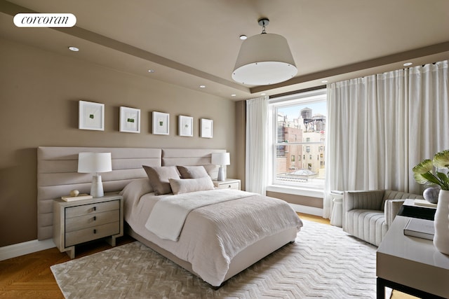 bedroom featuring baseboards, a view of city, visible vents, and recessed lighting